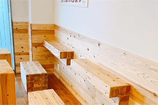 Warm wooden dine-in seating inside SoyStories Yakuin