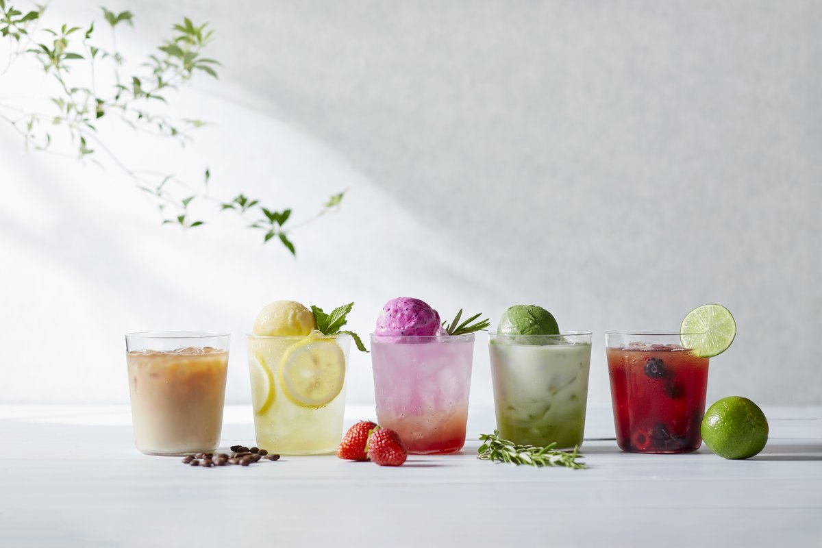 Five colorful drinks in glasses